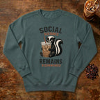 Social Distance Remains Skunk Sweatshirt in Blue Spruce, a retro skunk sipping iced coffee