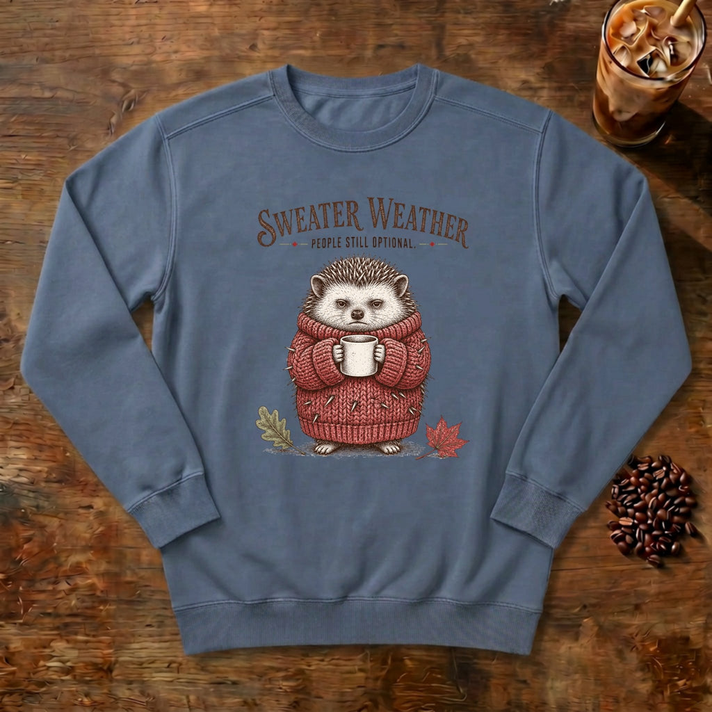 Sweater Weather Hedgehog Sweatshirt in Blue Jean, a hedgehog in a knit sweater holding a mug
