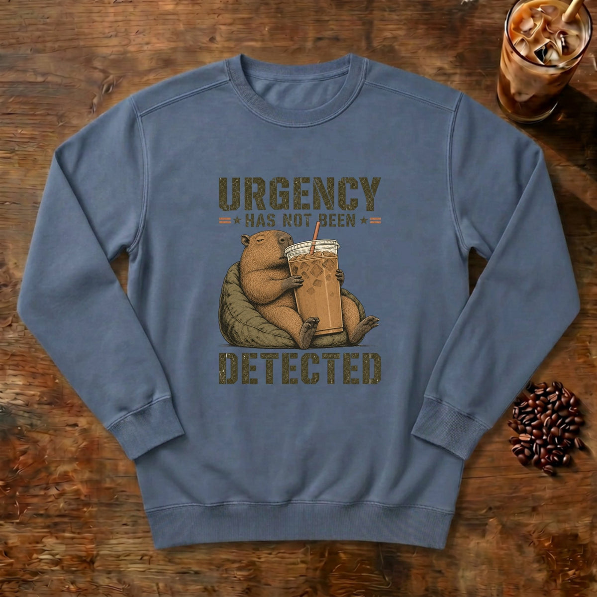 Urgency Not Detected Capybara Sweatshirt in Blue Jean, a relaxed capybara with its coffee