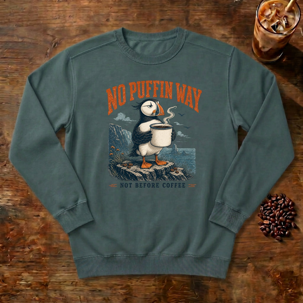No Puffin Way Sweatshirt in Blue Spruce, a puffin holding a cup of coffee by the coast