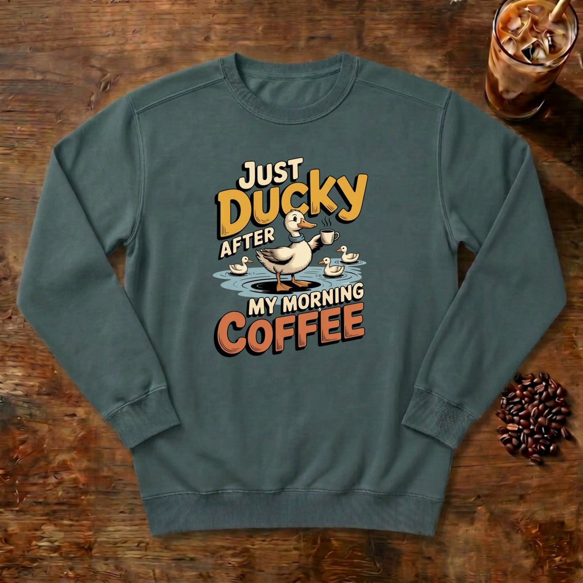 Just Ducky After My Morning Coffee Sweatshirt in Blue Spruce, a sleepy duck holding its coffee