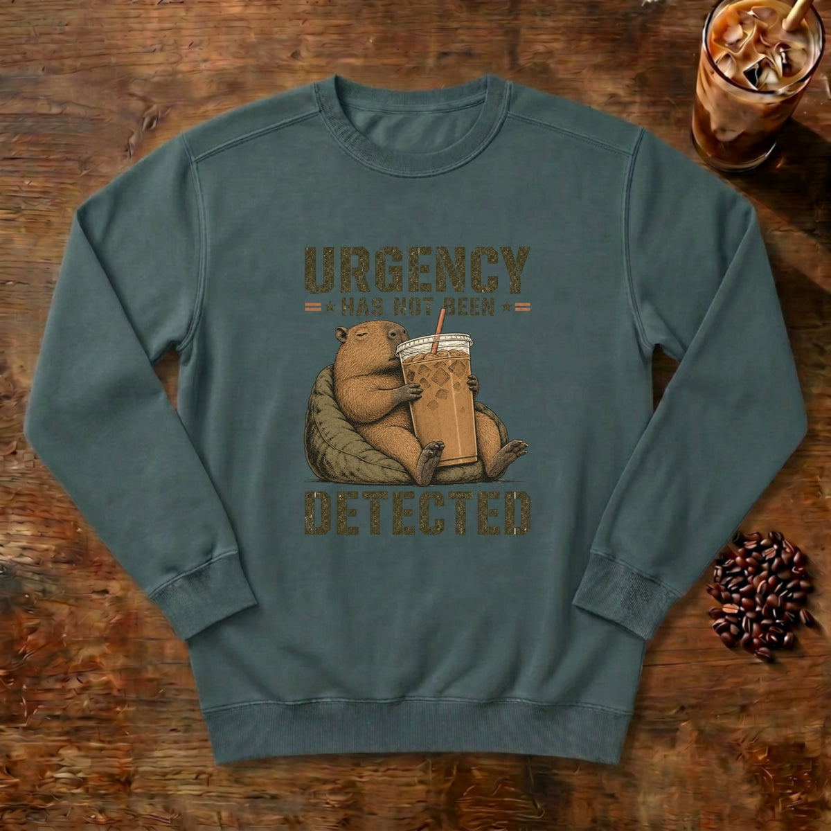 Urgency Not Detected Capybara Sweatshirt in Blue Spruce, a relaxed capybara with its coffee