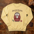 Sweater Weather Hedgehog Sweatshirt in Butter, a hedgehog in a knit sweater holding a mug