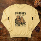 Urgency Not Detected Capybara Sweatshirt in Butter, a relaxed capybara with its coffee