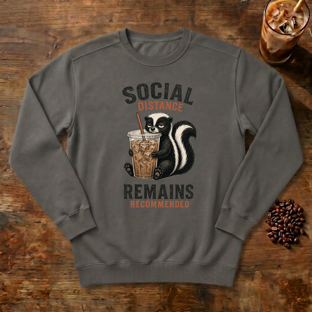 Social Distance Remains Skunk Sweatshirt in Pepper, a retro skunk sipping iced coffee
