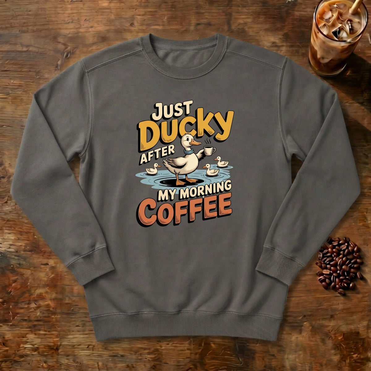 Just Ducky After My Morning Coffee Sweatshirt in Pepper, a sleepy duck holding its coffee