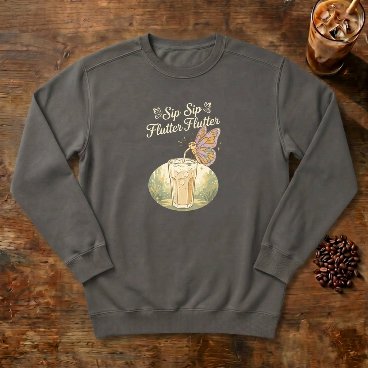 Sip Sip Flutter Flutter Butterfly Sweatshirt in Pepper, a monarch butterfly hovering over an iced coffee