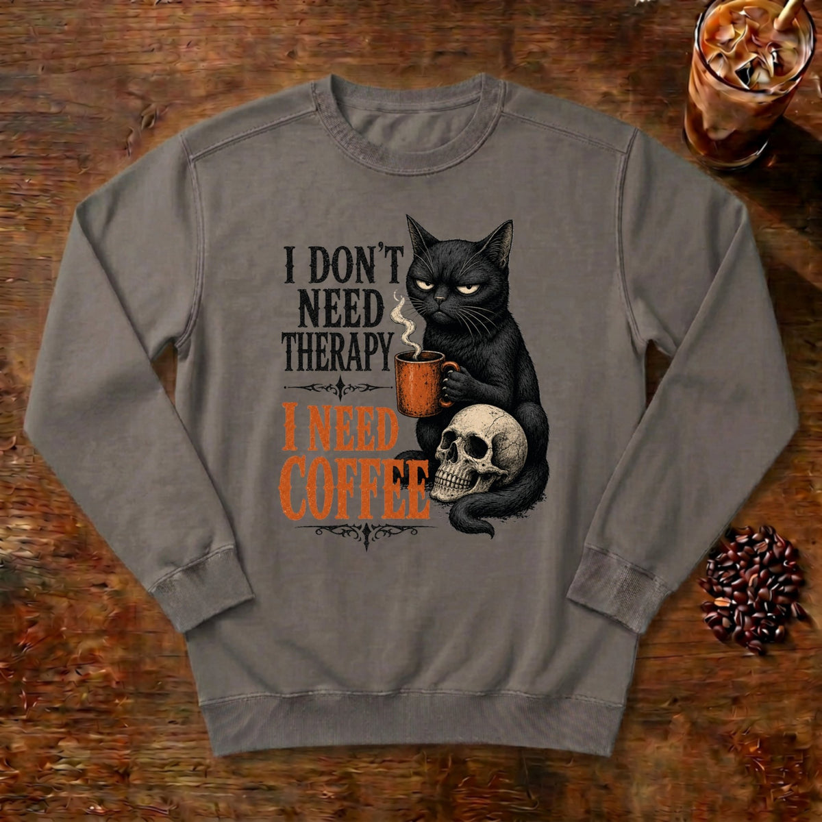 I Don't Need Therapy Cat Sweatshirt in Grey, a black cat holding a coffee mug and sitting on a skull