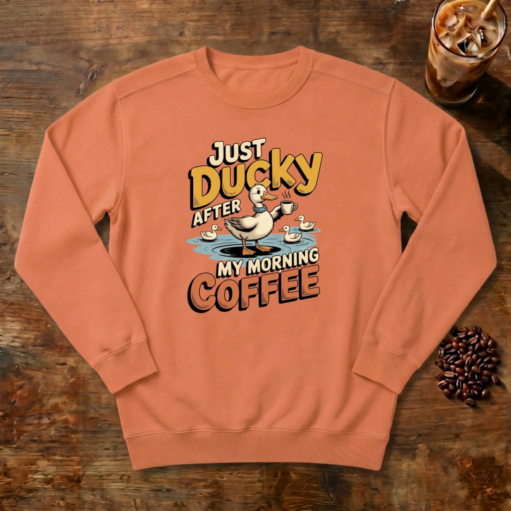 Just Ducky After My Morning Coffee Sweatshirt in Terracotta, a sleepy duck holding its coffee