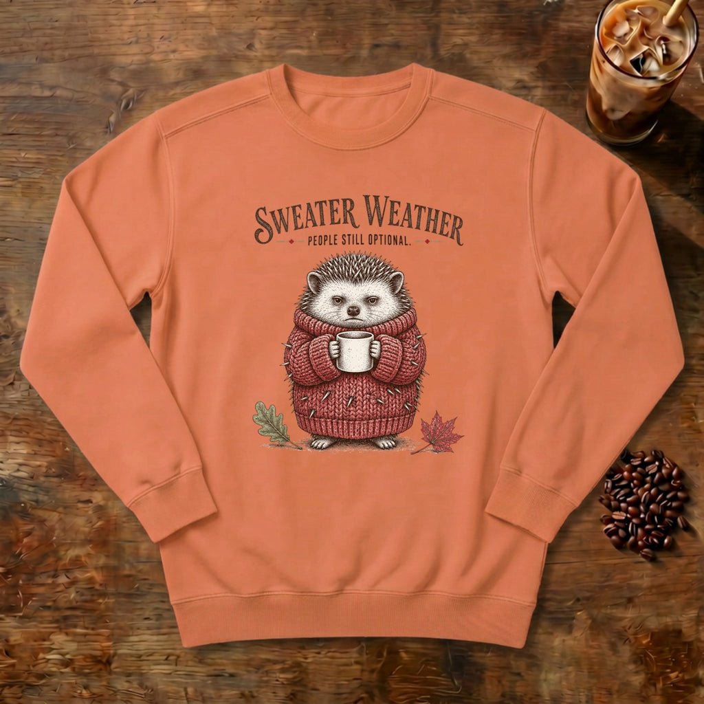 Sweater Weather Hedgehog Sweatshirt in Terracotta, a hedgehog in a knit sweater holding a mug