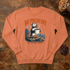 No Puffin Way Sweatshirt in Terracotta, a puffin holding a cup of coffee by the coast