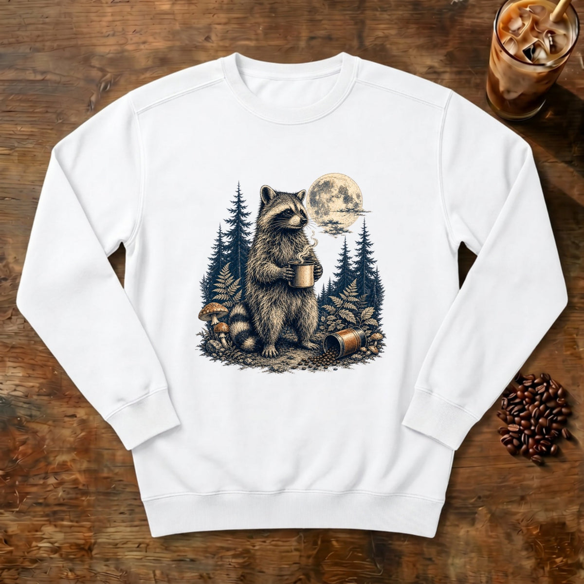 Moonlit Raccoon Coffee Sweatshirt in White, a raccoon with coffee in a moonlit forest
