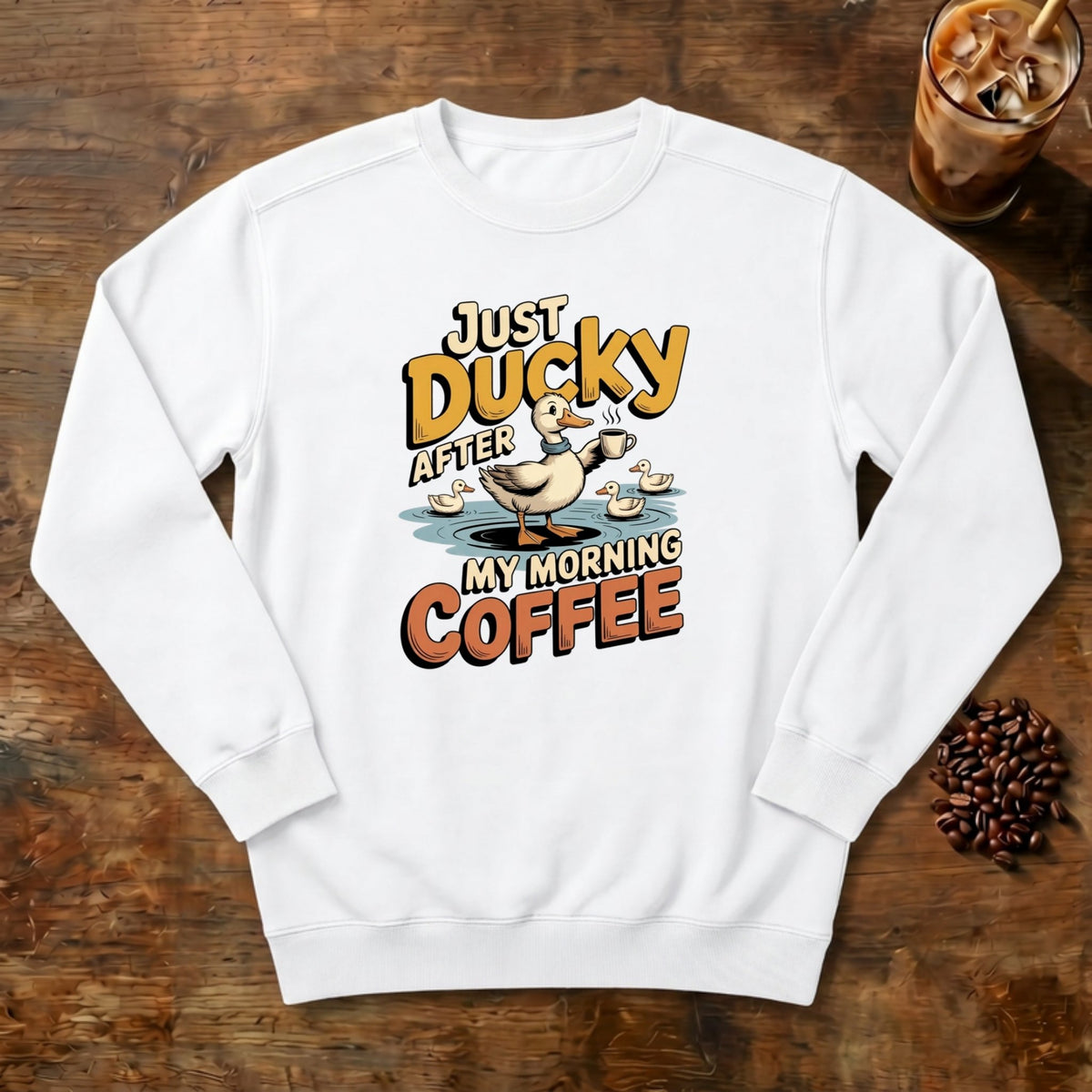 Just Ducky After My Morning Coffee Sweatshirt in White, a sleepy duck holding its coffee
