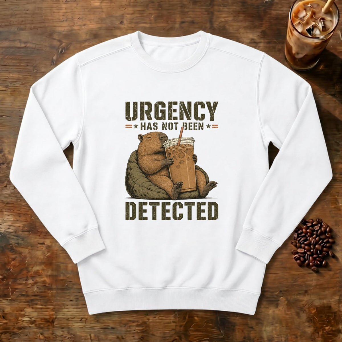 Urgency Not Detected Capybara Sweatshirt in White, a relaxed capybara with its coffee