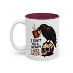 I Don't Need Therapy Raven Coffee Mug, 11 oz, white with maroon interior. Raven perched on a skull holding a dripping coffee mug with “I Don't Need Therapy” text
