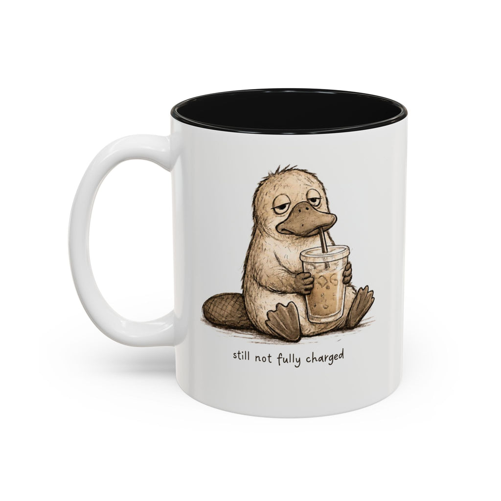 Still Not Fully Charged Platypus Coffee Mug, another view. Sleepy platypus sipping iced coffee with “still not fully charged” text