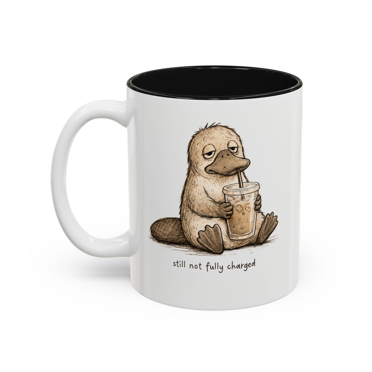Still Not Fully Charged Platypus Coffee Mug, another view. Sleepy platypus sipping iced coffee with “still not fully charged” text
