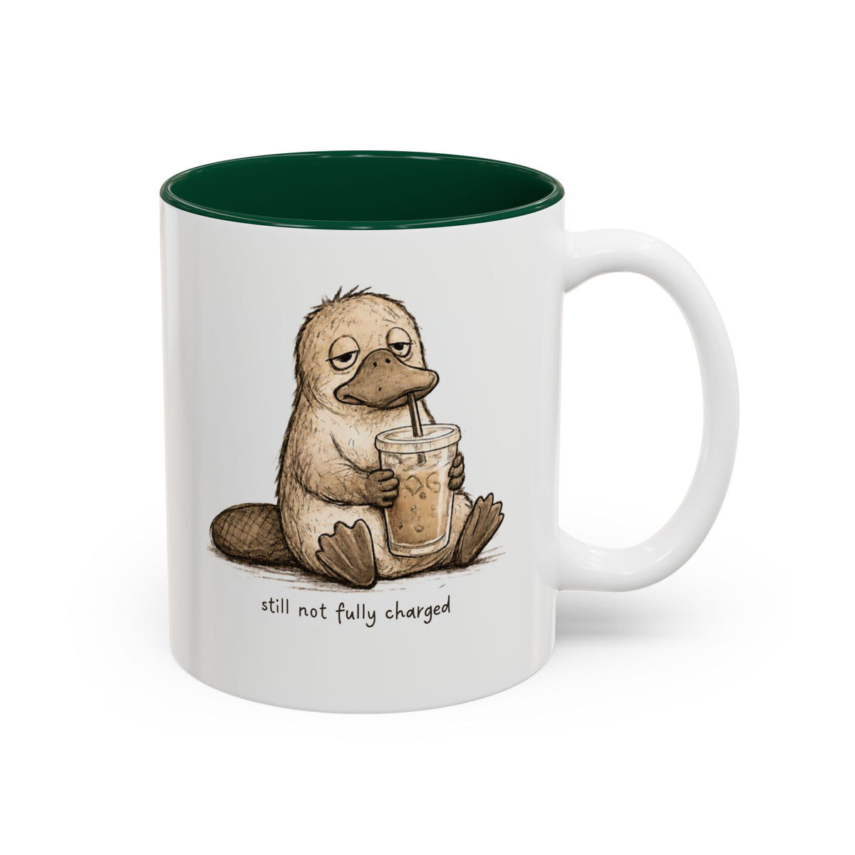 Still Not Fully Charged Platypus Coffee Mug, white with green interior. Sleepy platypus sipping iced coffee with “still not fully charged” text