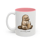 Still Not Fully Charged Platypus Coffee Mug, another view. Sleepy platypus sipping iced coffee with “still not fully charged” text