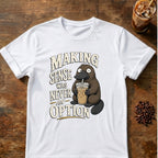 Wide-eyed platypus sipping an iced coffee beside the words Making Sense Was Never an Option on a White T-shirt.