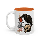 I Don't Need Therapy Raven Coffee Mug, 11 oz, white with orange interior. Raven perched on a skull holding a dripping coffee mug with “I Don't Need Therapy” text