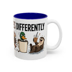 Everyone Copes Differently Animal Coffee Mug, another view. Wraparound mug with a raccoon, sloth, squirrel, duck and otter coping with coffee under “Everyone Copes Differently”