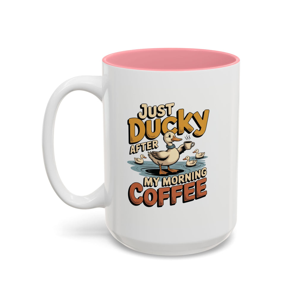 Just Ducky After My Morning Coffee Mug, 15 oz, white with pink interior. Cheerful duck raising a coffee cup in a pond with ducklings and “Just Ducky After My Morning Coffee” text