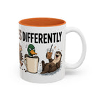 Everyone Copes Differently Animal Coffee Mug, another view. Wraparound mug with a raccoon, sloth, squirrel, duck and otter coping with coffee under “Everyone Copes Differently”