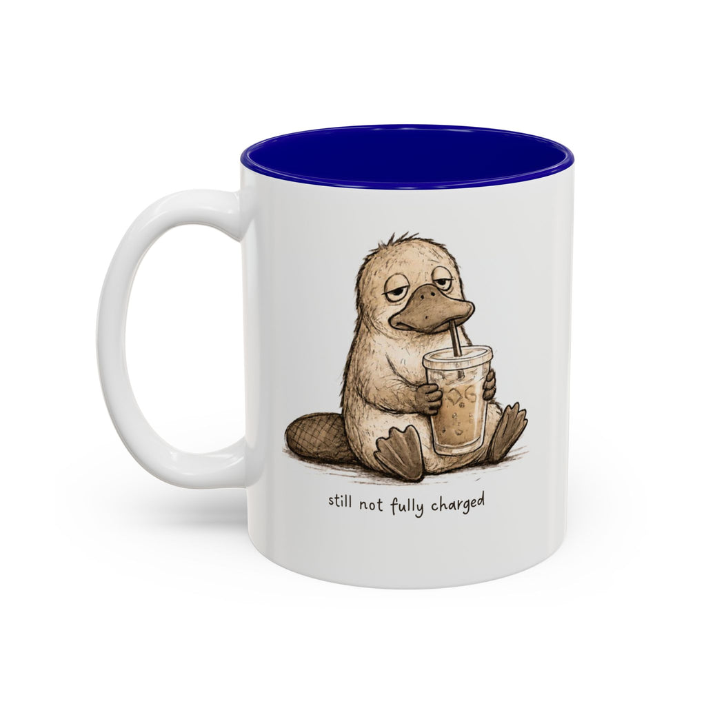 Still Not Fully Charged Platypus Coffee Mug, another view. Sleepy platypus sipping iced coffee with “still not fully charged” text