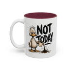 Not Today Duck Coffee Mug, 11 oz, white with maroon interior. Wild-haired duck watching his coffee spill from a tipped mug
