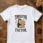 Penguin in a beanie and scarf hugging a giant iced coffee in the snow with the words Temperature Is Not a Factor on a White T-shirt.