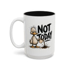 Not Today Duck Coffee Mug, 15 oz, white with black interior. Wild-haired duck watching his coffee spill from a tipped mug