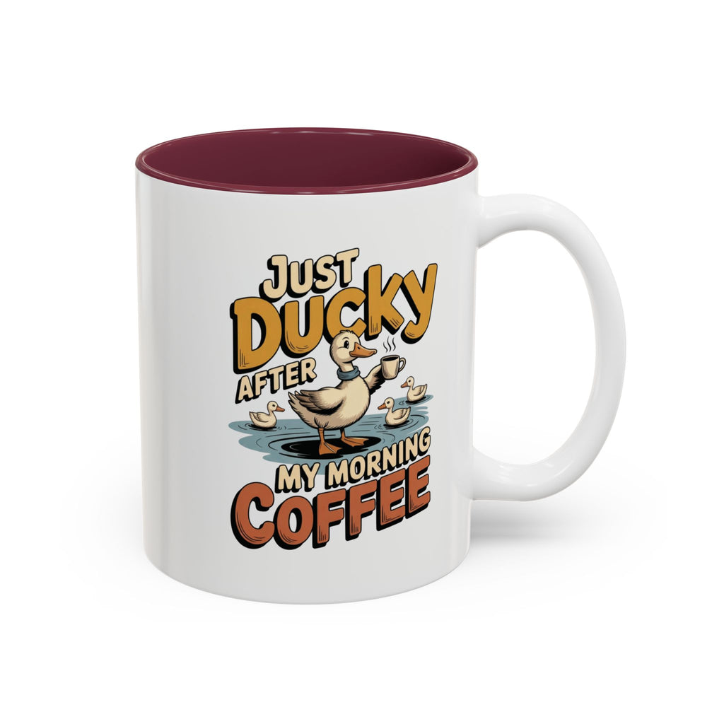 Just Ducky After My Morning Coffee Mug, another view. Cheerful duck raising a coffee cup in a pond with ducklings and “Just Ducky After My Morning Coffee” text