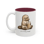 Still Not Fully Charged Platypus Coffee Mug, another view. Sleepy platypus sipping iced coffee with “still not fully charged” text