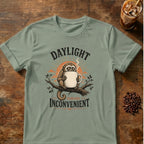 Owl Monkey graphic for Daylight Remains Inconvenient Owl Monkey on Sage T-shirt
