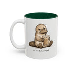 Still Not Fully Charged Platypus Coffee Mug, another view. Sleepy platypus sipping iced coffee with “still not fully charged” text