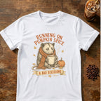 Sleepy opossum in a scarf holding a steaming mug beside a pumpkin with the words Running on Pumpkin Spice & Bad Decisions on a White T-shirt.