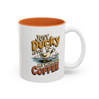 Just Ducky After My Morning Coffee Mug, another view. Cheerful duck raising a coffee cup in a pond with ducklings and “Just Ducky After My Morning Coffee” text