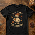 Grumpy duck in a knit beanie holding a steaming coffee among falling leaves with the words Fall Plans: Coffee & Avoiding People on a Black T-shirt.