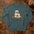 Still Not Fully Charged Platypus Sweatshirt in Blue Spruce, a sleepy platypus sipping iced coffee