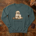 Still Not Fully Charged Platypus Sweatshirt in Blue Spruce, a sleepy platypus sipping iced coffee