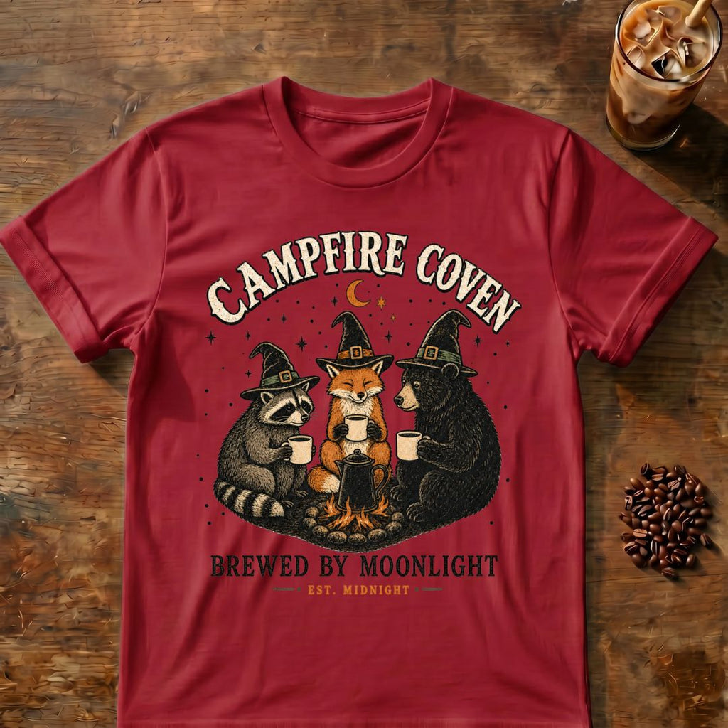 Raccoon coffee graphic for Campfire Coven Coffee on cardinal-red T-shirt