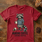 Raccoon coffee graphic on a Cardinal Red T-shirt