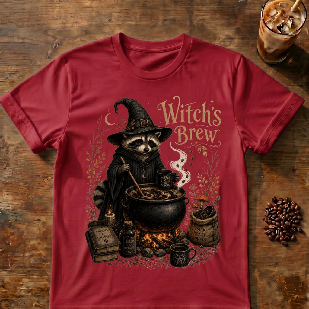 Raccoon coffee graphic for Witch's Brew Raccoon Coffee on cardinal-red T-shirt