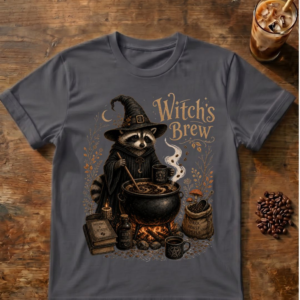 Raccoon dressed as a witch stirring a coffee cauldron with “Witch's Brew” text and coffee-themed spell details