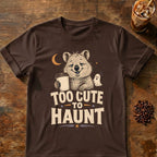 Smiling quokka holding a takeaway coffee beside a tiny ghost with “Too Cute to Haunt” text