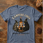 Raccoon coffee graphic for Campfire Coven Coffee on heather-indigo T-shirt