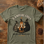 Raccoon coffee graphic for Campfire Coven Coffee on heather-military-green T-shirt
