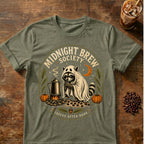 Raccoon coffee graphic for Midnight Brew Society Raccoon on heather-military-green T-shirt