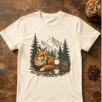 Red fox resting beside a steaming camp coffee mug and backpack with pine forest and mountains behind
